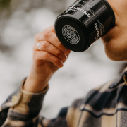 Girl drinking from Inveralmond mug